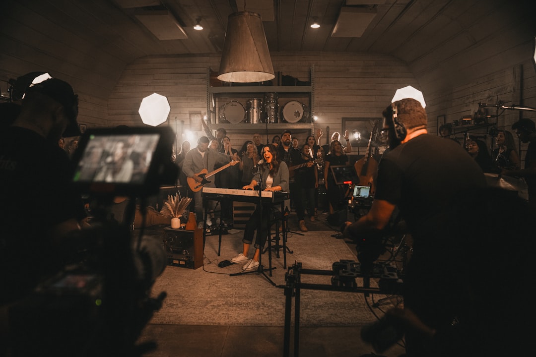 a group of people standing around a room